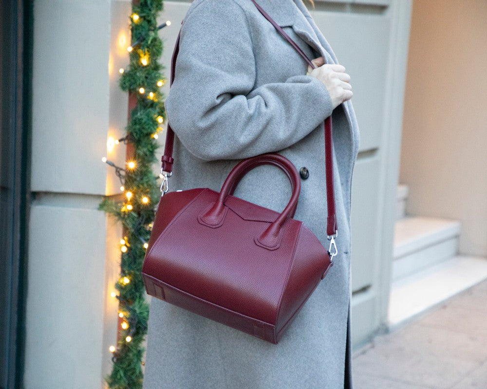 Alessia women's Bordeaux leather handbag worn over the shoulder