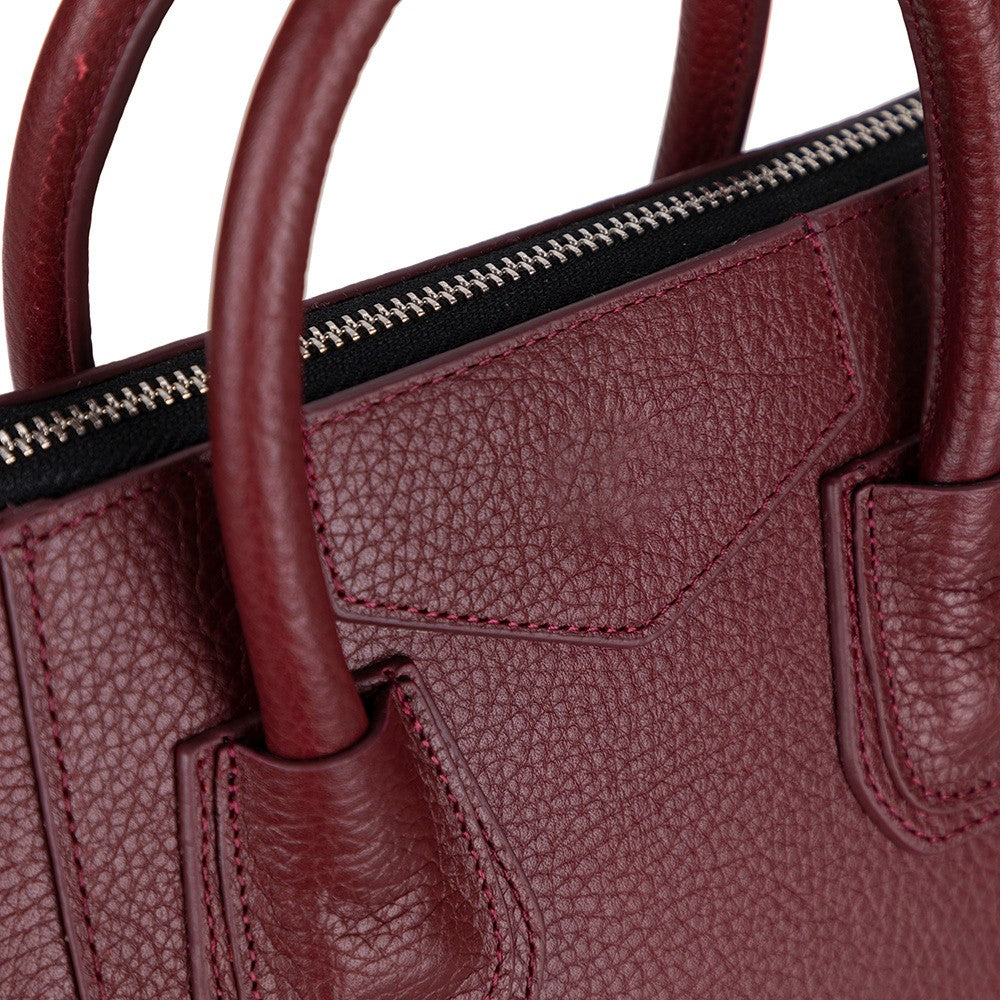 Close-up of Alessia women's Bordeaux leather bag texture and stitching