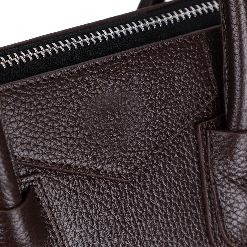 Close-up of Alessia women's dark brown leather bag texture and stitching