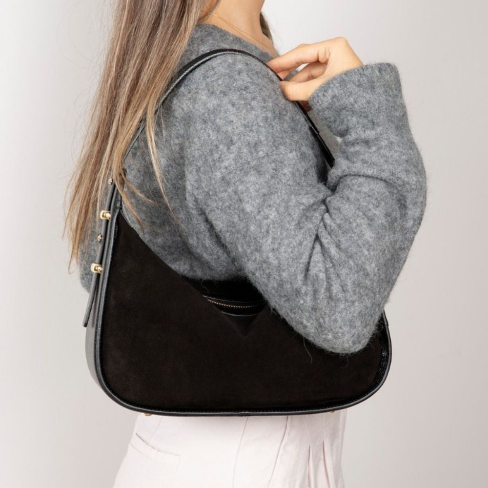 Bellara women's black leather handbag worn over the shoulder