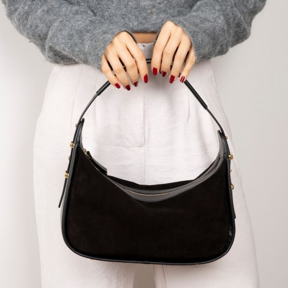 Bellara women's black leather bag carried by hand