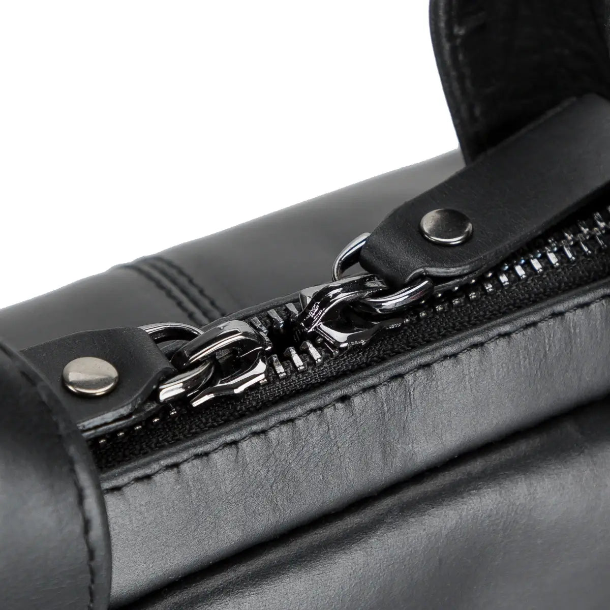 Close-up of a black leather briefcase with a silver zipper on a white background