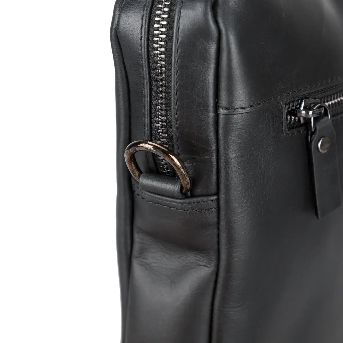 Close-up of a black leather briefcase with zipper details on a white background