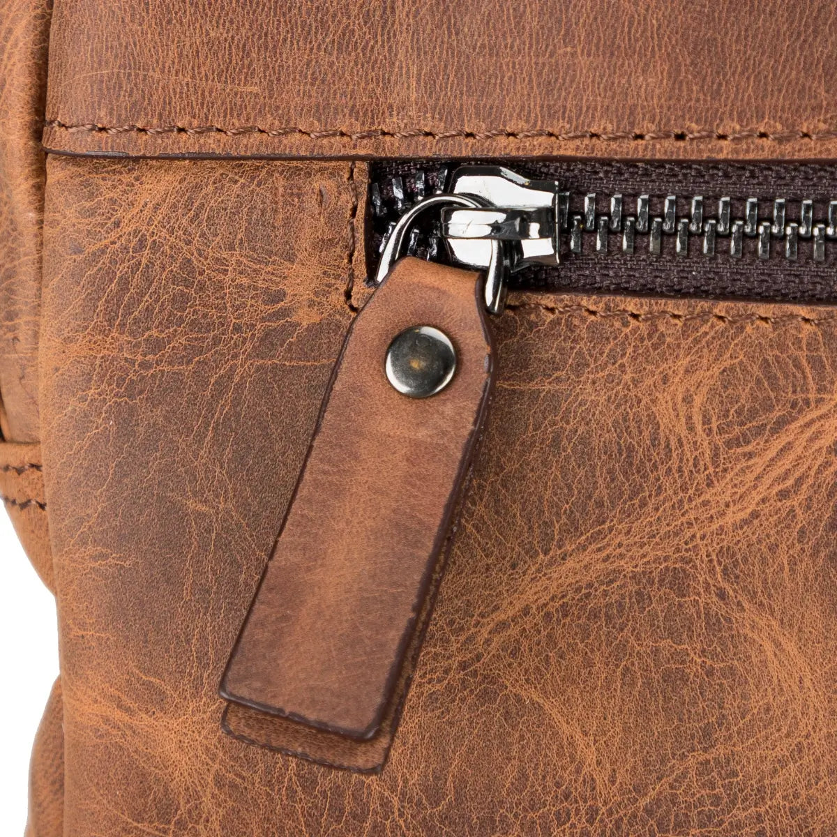 Close-up of a brown leather briefcase with a zipper and leather pull tab.