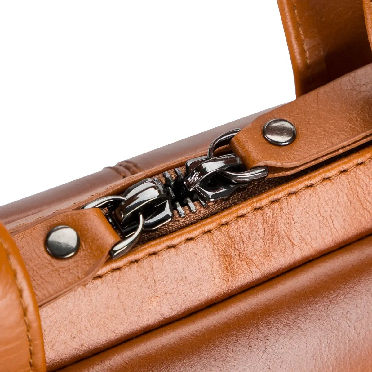 Close-up of a brown leather briefcase with silver zipper pull and hardware.
