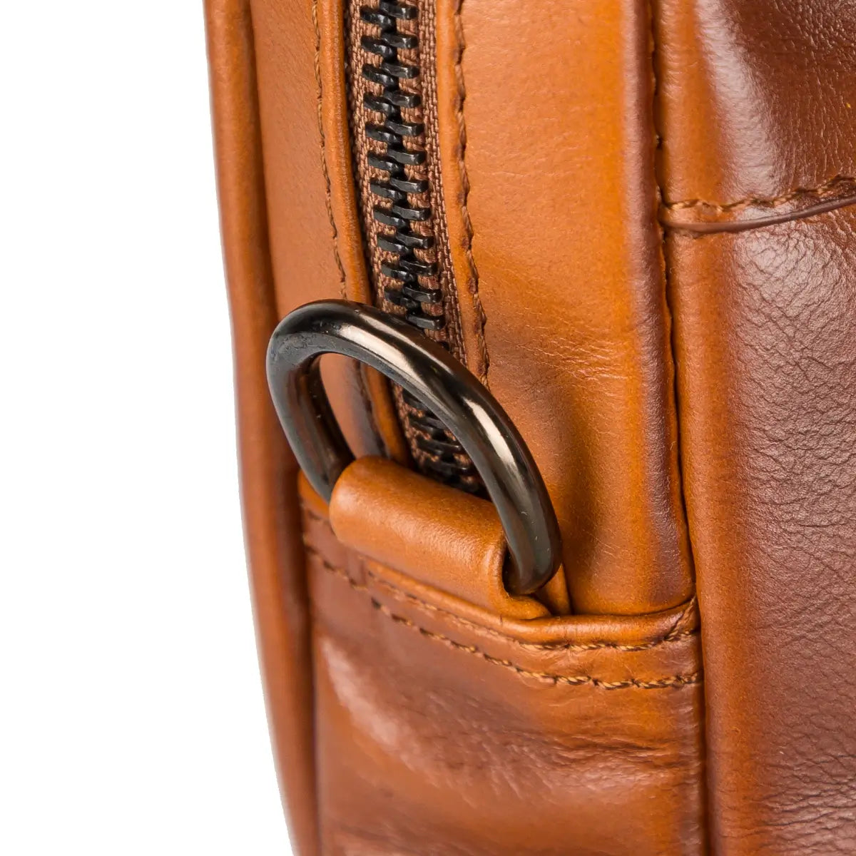 Close-up of a brown leather briefcase with a metal zipper pull.