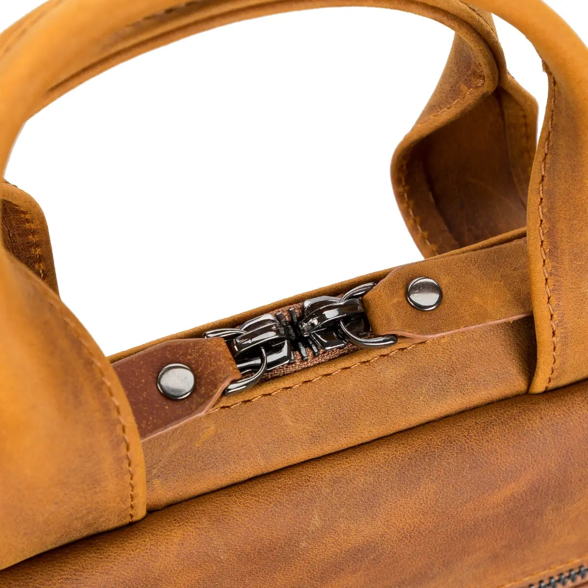 Close-up of a brown leather briefcase with a zipper and metal accents on a white background