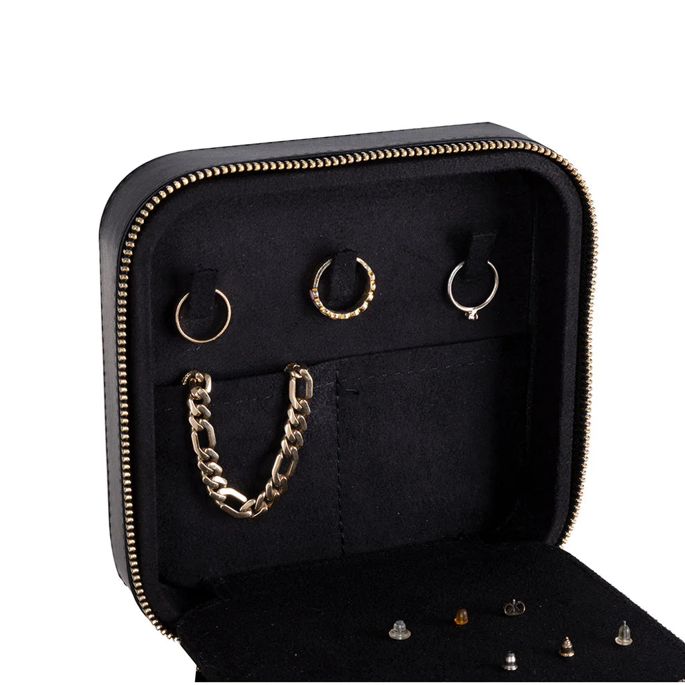Black leather jewelry box with gold chain and earrings