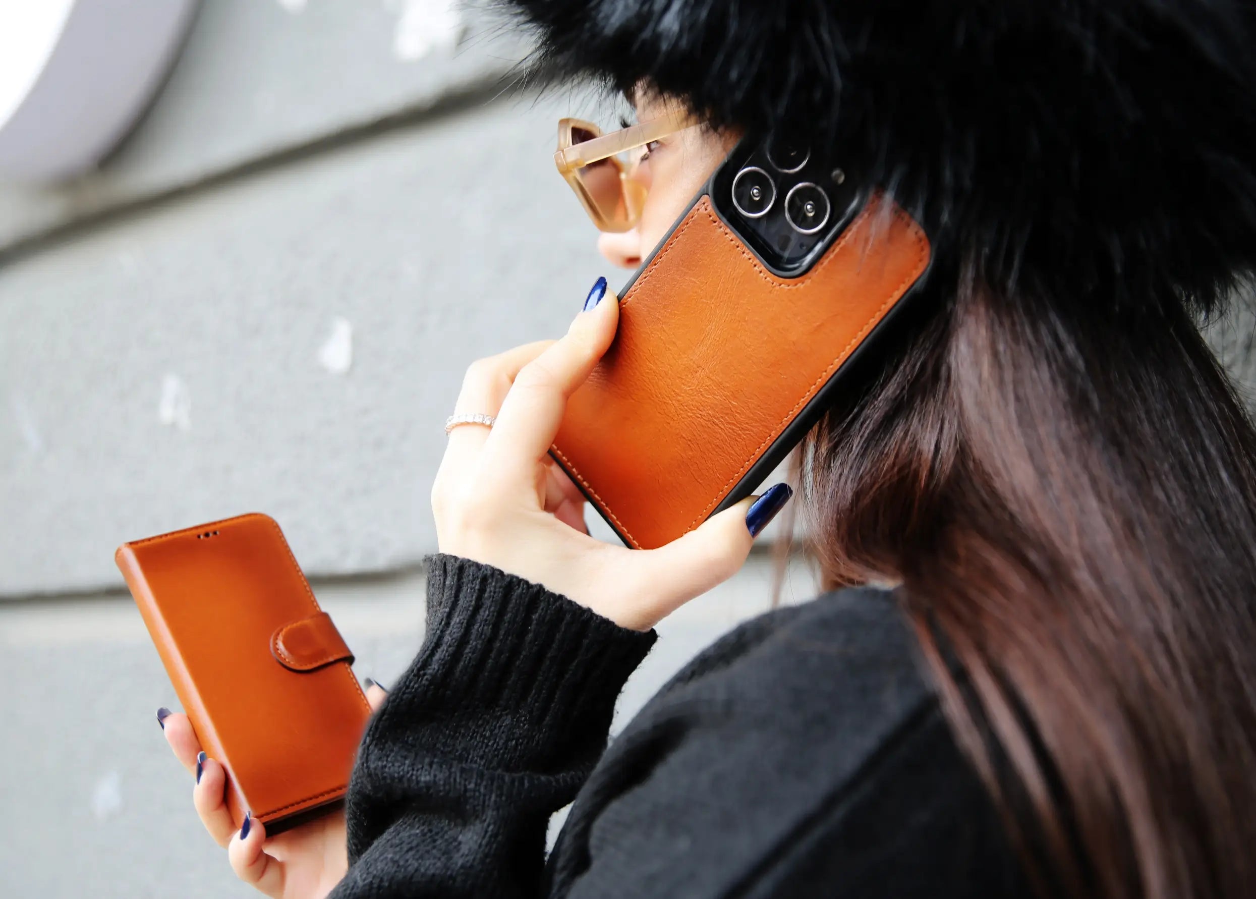 A woman holding a brown leather iphone 16 case-O2 Leather