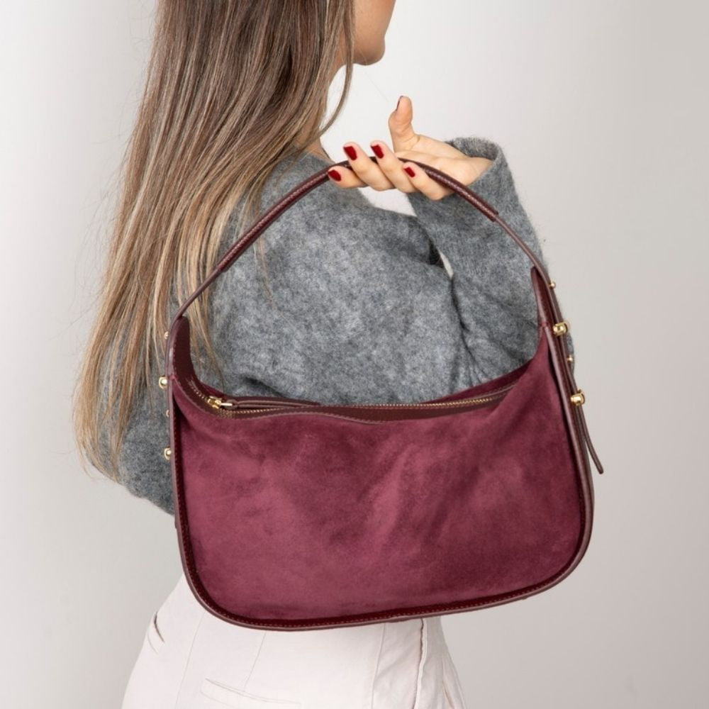 Bellara women's Burgundy leather bag carried by hand