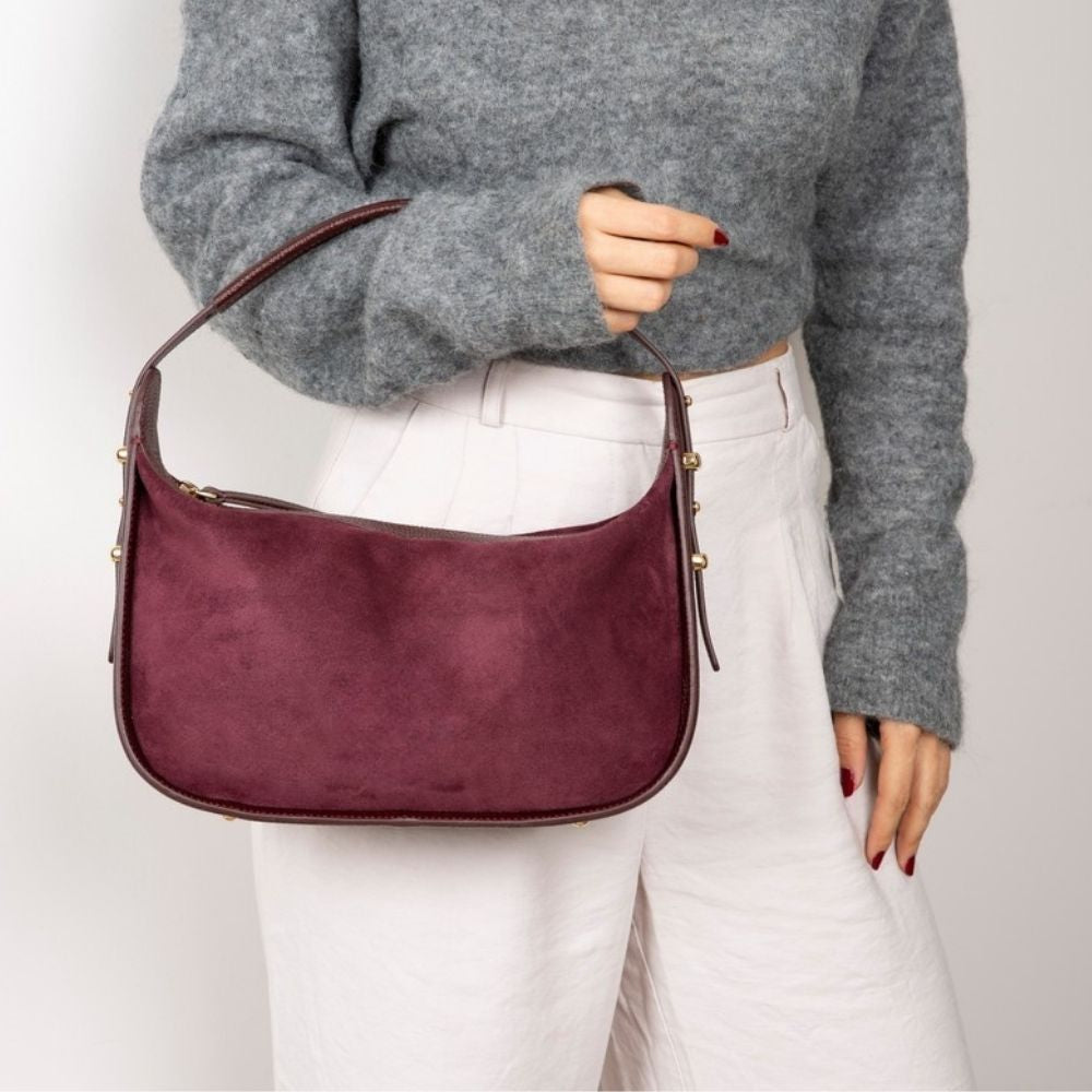 Bellara women's Burgundy leather bag carried by hand