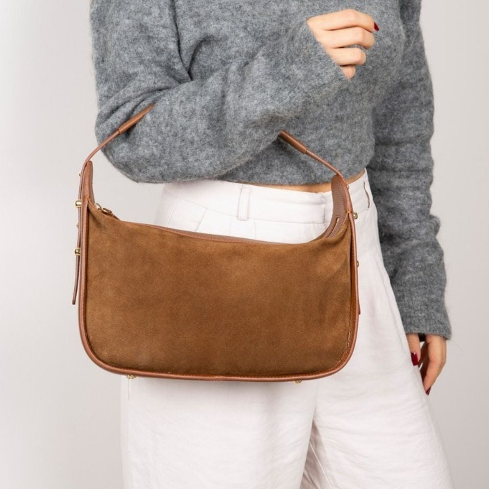 Bellara women's tan leather bag carried by hand