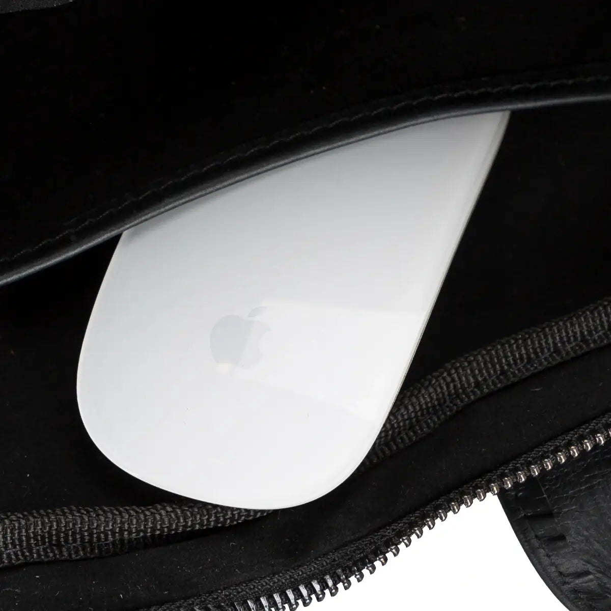 Close-up of a briefcase with a white Apple product inside