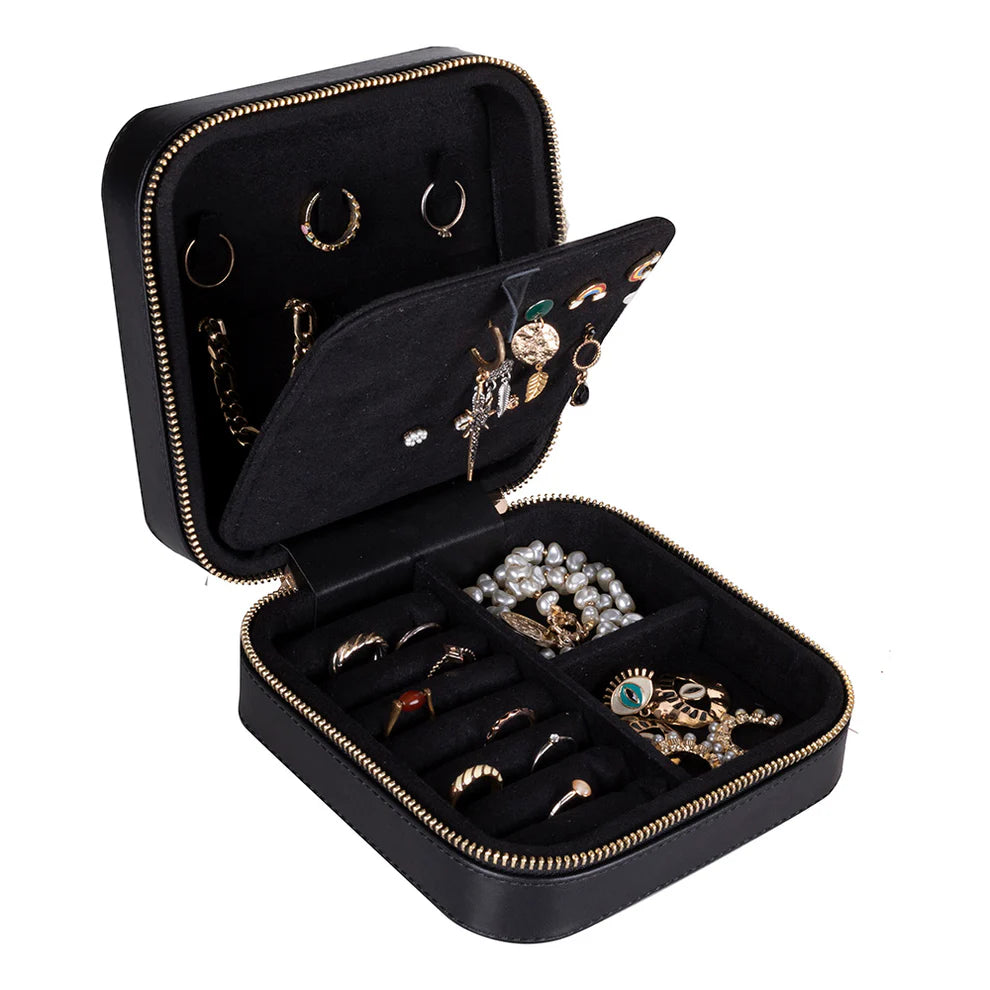 Black leather jewelry case with gold zipper containing various jewelry items 